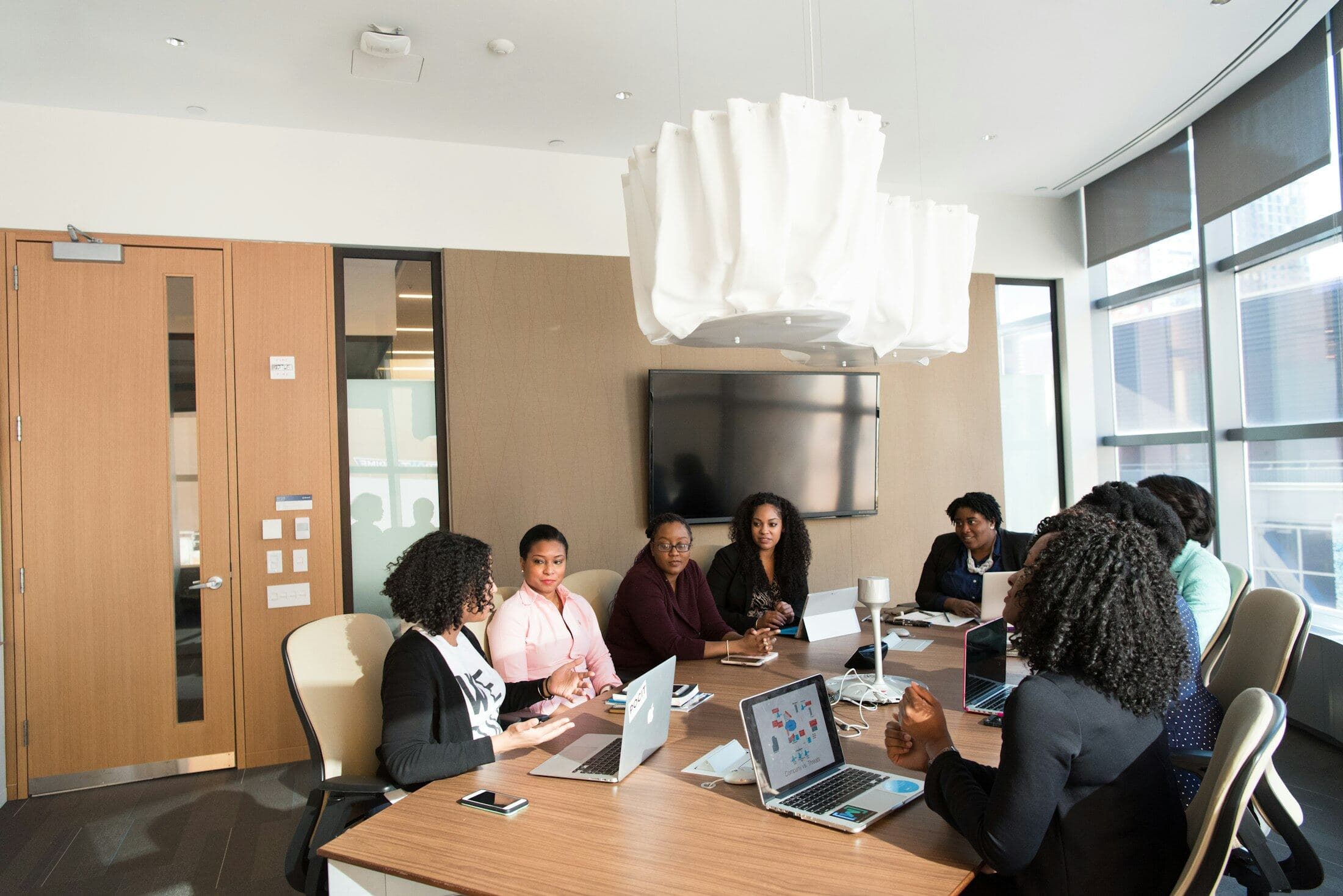 A team meeting around a table in a bright office